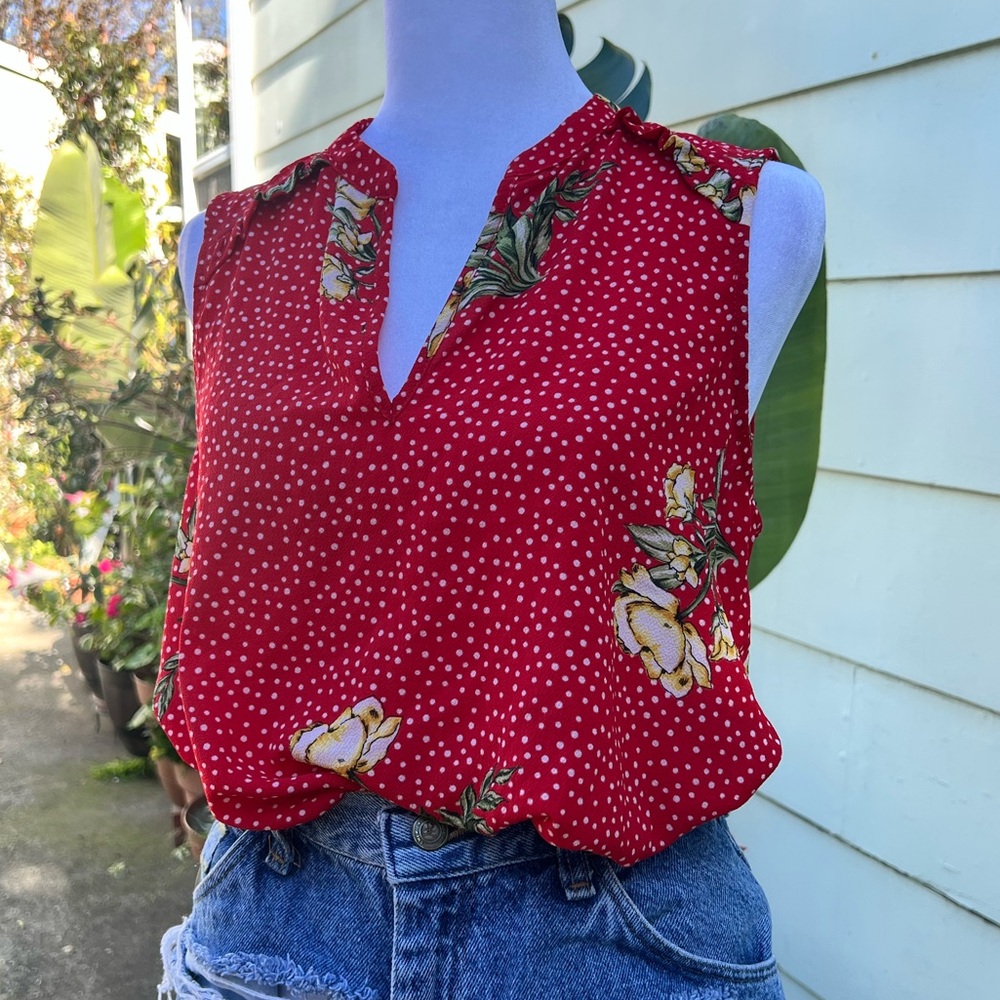 Red floral sleeveless V-neck blouse